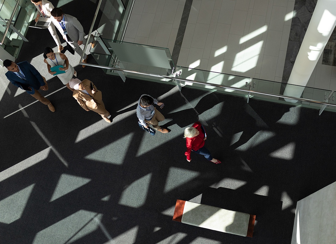 Insurance Solutions - Overhead View of People Walking Through a Lobby